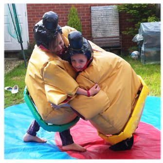 children playing wearing sumo suits